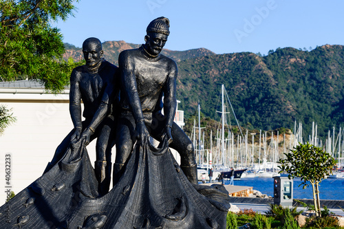 Fishermans's statue at Marmaris city embankment photo