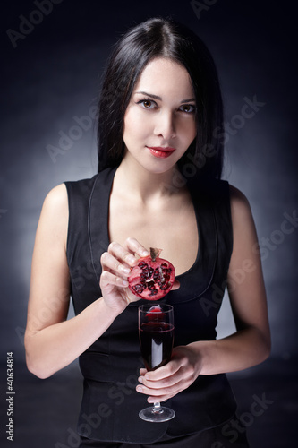 beautiful woman with pomegranates