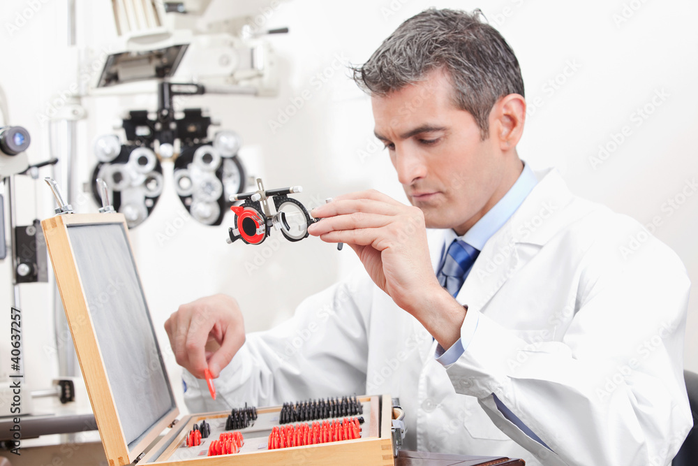 Optometrist Holding Measuring Eye Glasses Optometrist Holding Measuring Eye Glasses