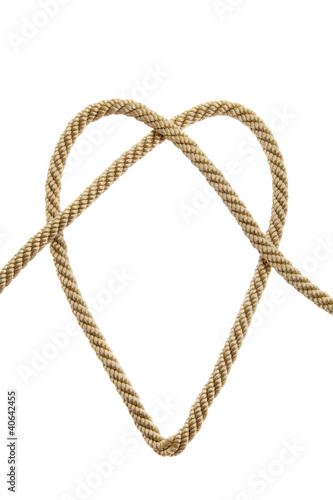 Heart Shaped Knot on a golden rope isolated