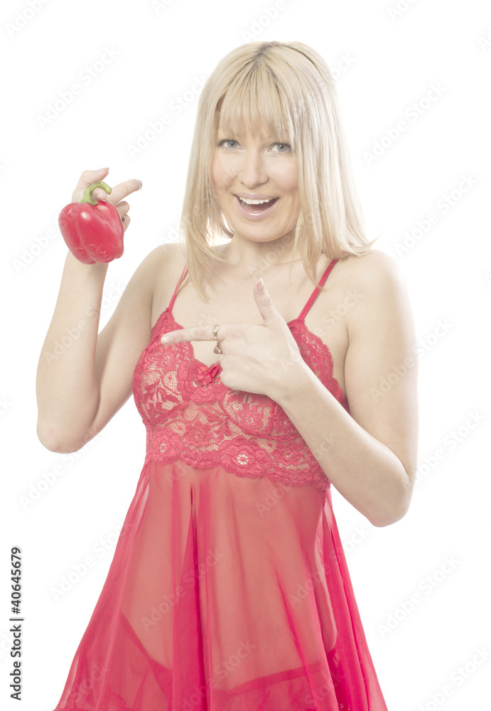 The young woman holds red pepper