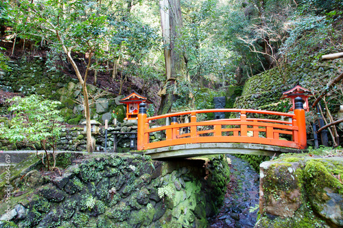 japanese red bridge in the mountains (Kurama, Kyoto) photo