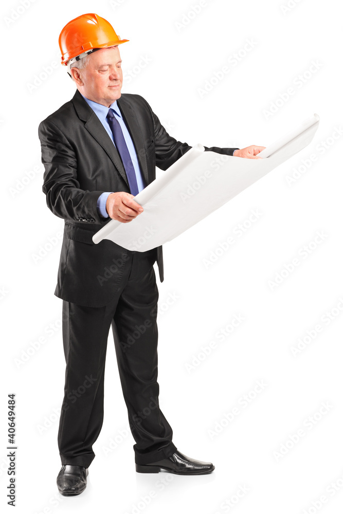 Mature construction worker with helmet holding blueprint Mature construction worker with helmet holding blueprint