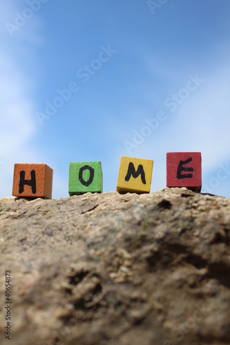 The word HOME written on wooden cubes photo