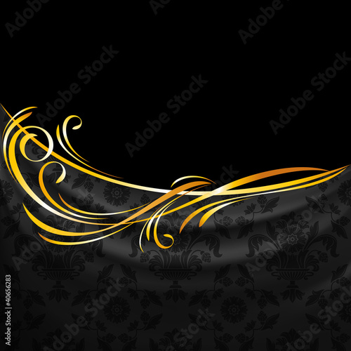 Dark fabric ornamental drapes on black background