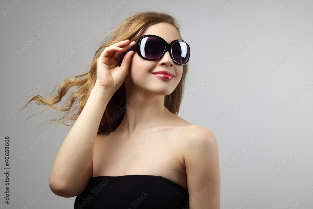 Fashionable lady wearing sunglasses Fashionable lady wearing sunglasses