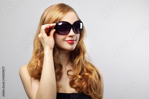 Fashionable lady wearing sunglasses