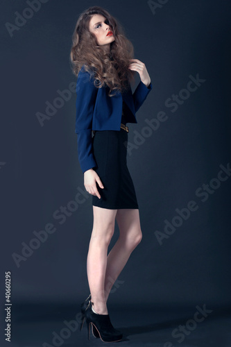 Studio shot of beautiful teenager girl in fashion clothes