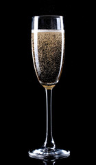 glass of champagne on black background