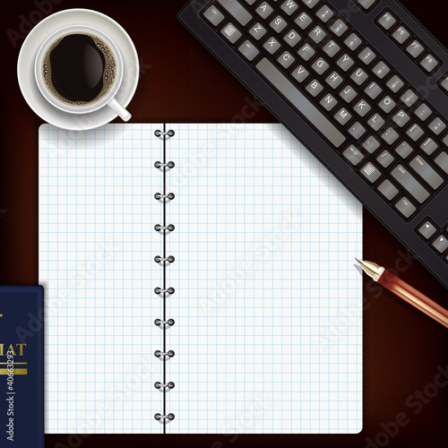 office desk with coffee keyboard and notepad