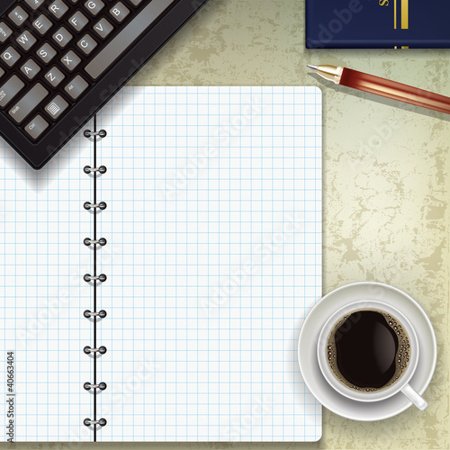 office desk with keyboard coffee and notepad
