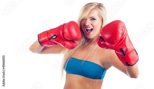 Photo of young wonderful woman wearing boxing glove © Alen-D