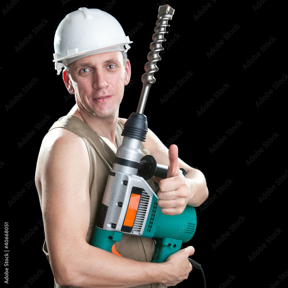 The builder with a drill of the big diameter The builder with a drill of the big diameter