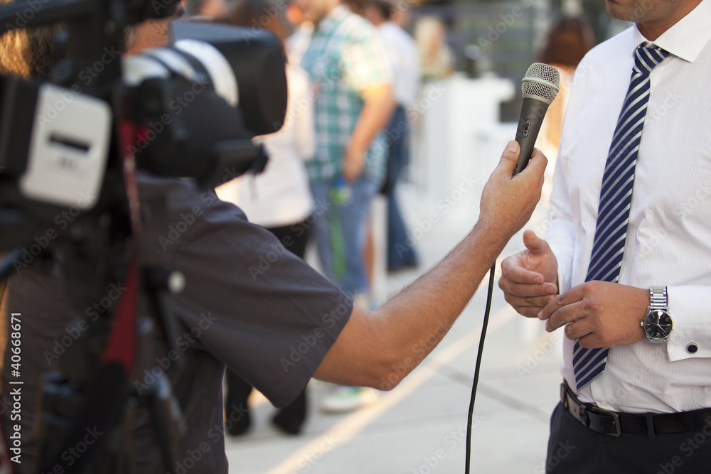 Naklejka premium tv interview with a businessman