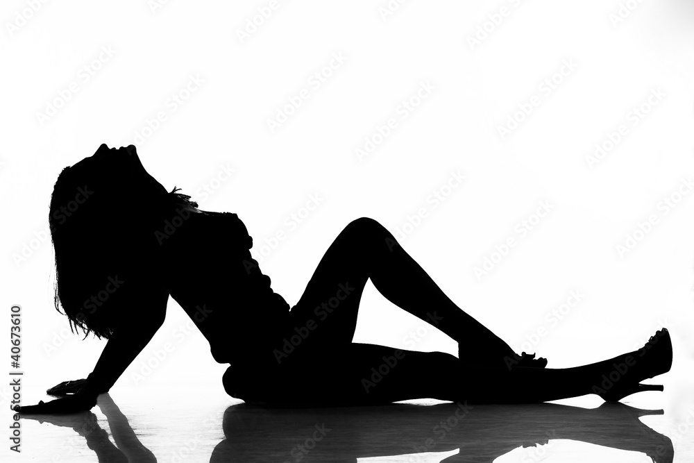 Naklejka premium Silhouette of lying sexy woman as logo