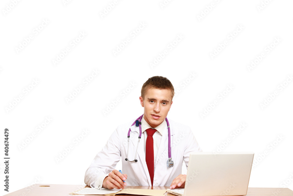 The doctor writing in office