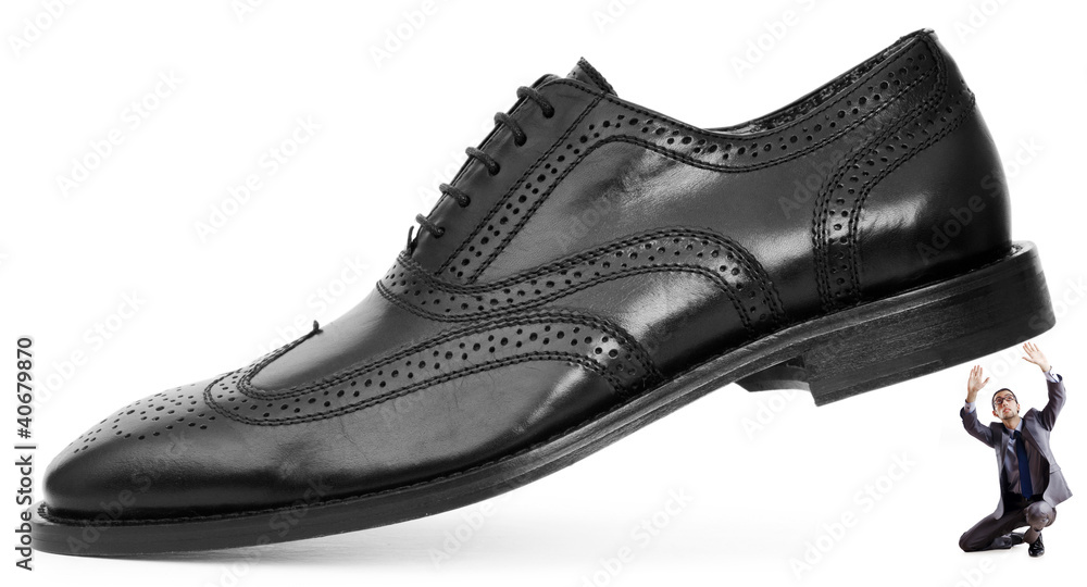 Woman domination concept with shoes and man Woman domination concept with shoes and man