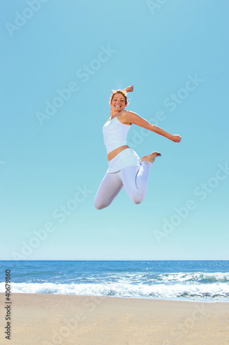 young beautiful woman jumping