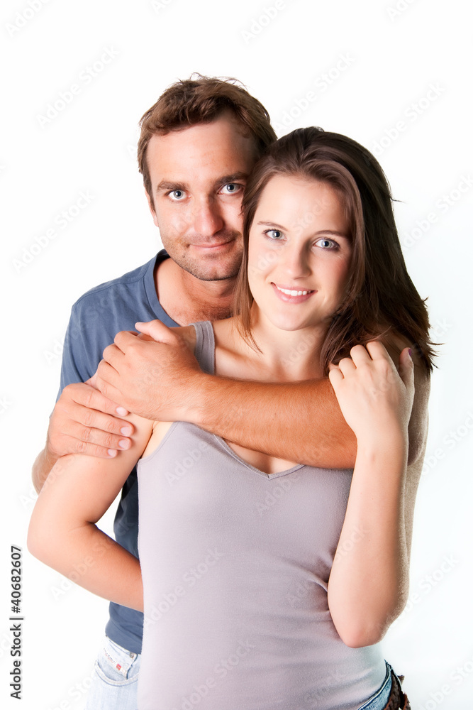 Couple hugging eachother on isolated white Couple hugging eachother on isolated white