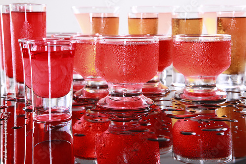 Red drinks on wet bar photo