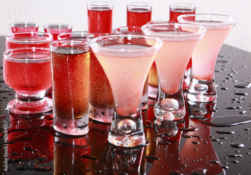 Red drinks on wet bar photo