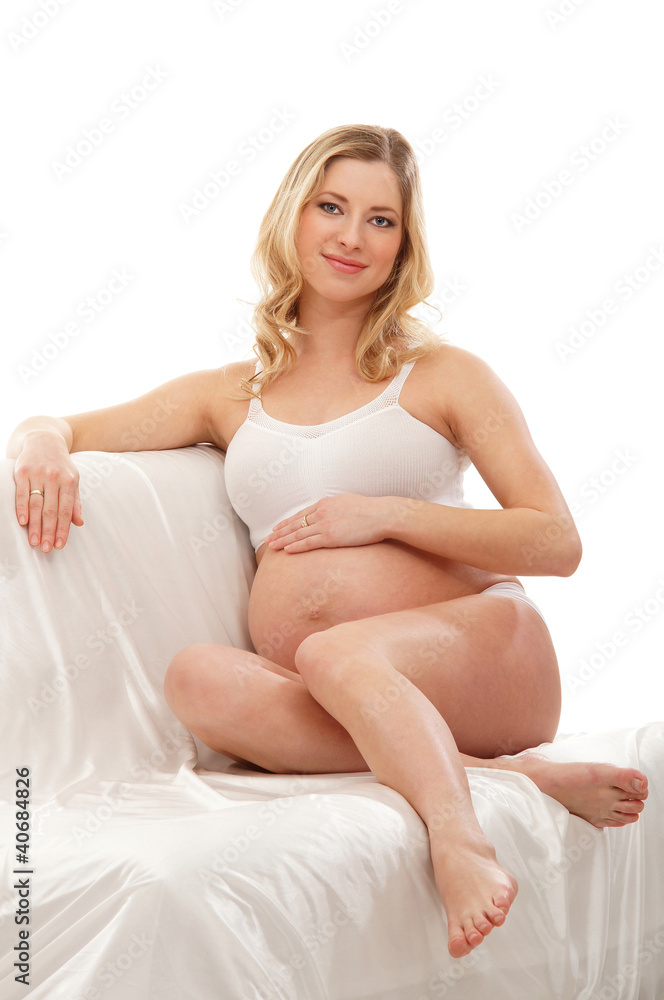 A young and happy blond pregnant Caucasian woman A young and happy blond pregnant Caucasian woman