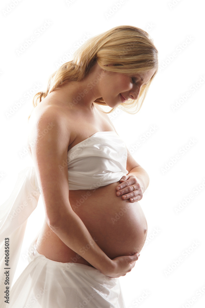 A young and happy blond pregnant Caucasian woman A young and happy blond pregnant Caucasian woman