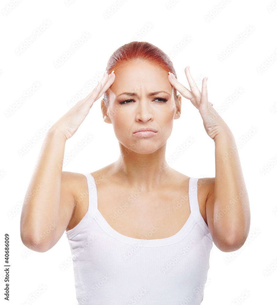 A young redhead Caucasian woman feeling a headache A young redhead Caucasian woman feeling a headache