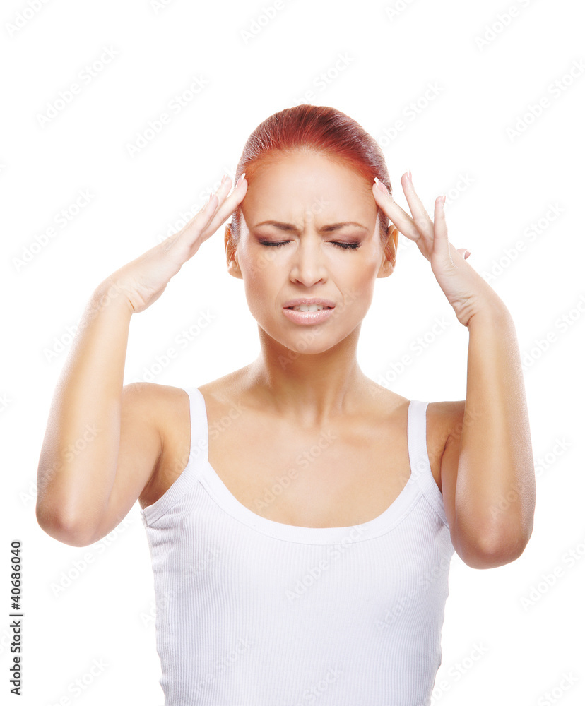 A young redhead Caucasian woman feeling a headache A young redhead Caucasian woman feeling a headache