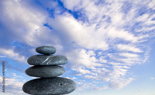 balancing zen stones and blue sky
