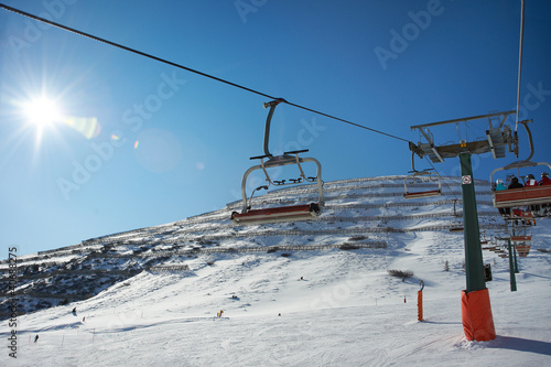 Ski lifts and slope with protection from avalanches