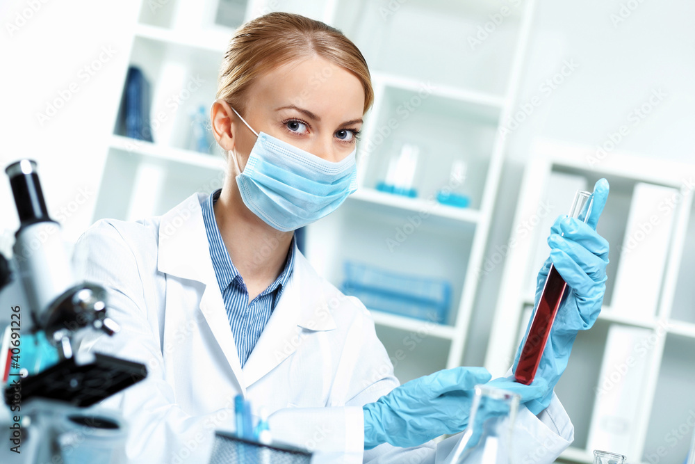 Young scientist working in laboratory Young scientist working in laboratory