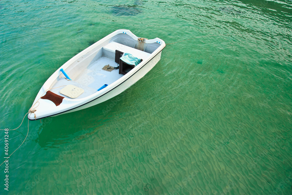 Boat in clear water Boat in clear water