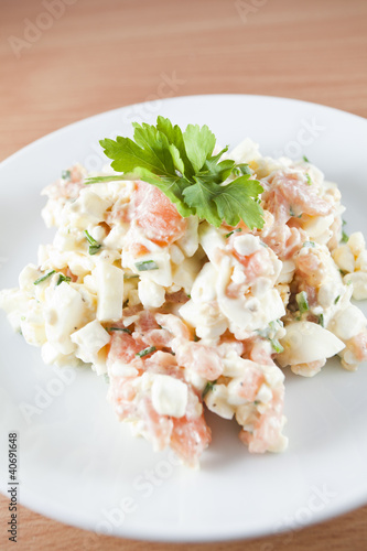 Fresh salad made of salmon peaces, eggs and herbs - Ducan diet