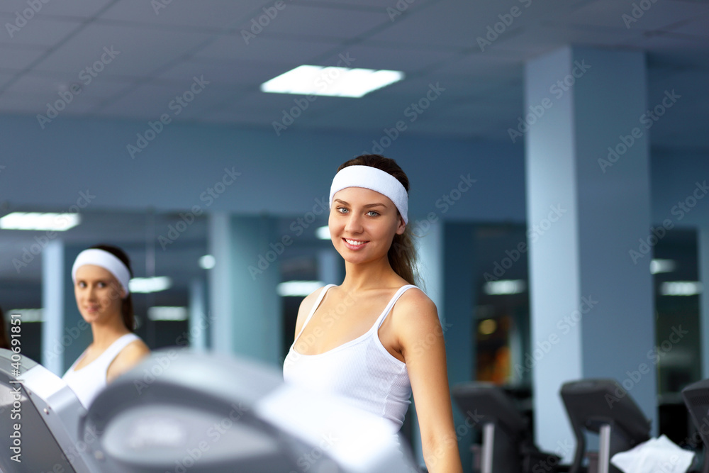 Woman in sport wear doing sport in gym Woman in sport wear doing sport in gym