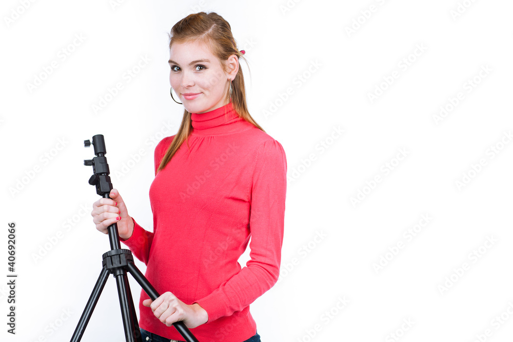 young model/photo assistent helping to set up the studio