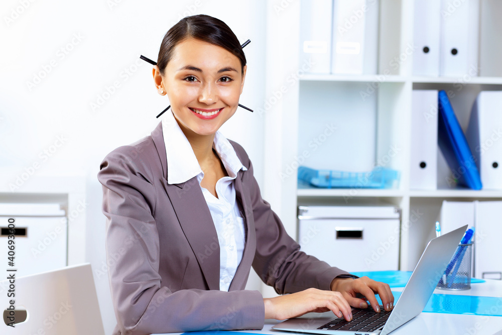 Young woman in business wear working in office Young woman in business wear working in office