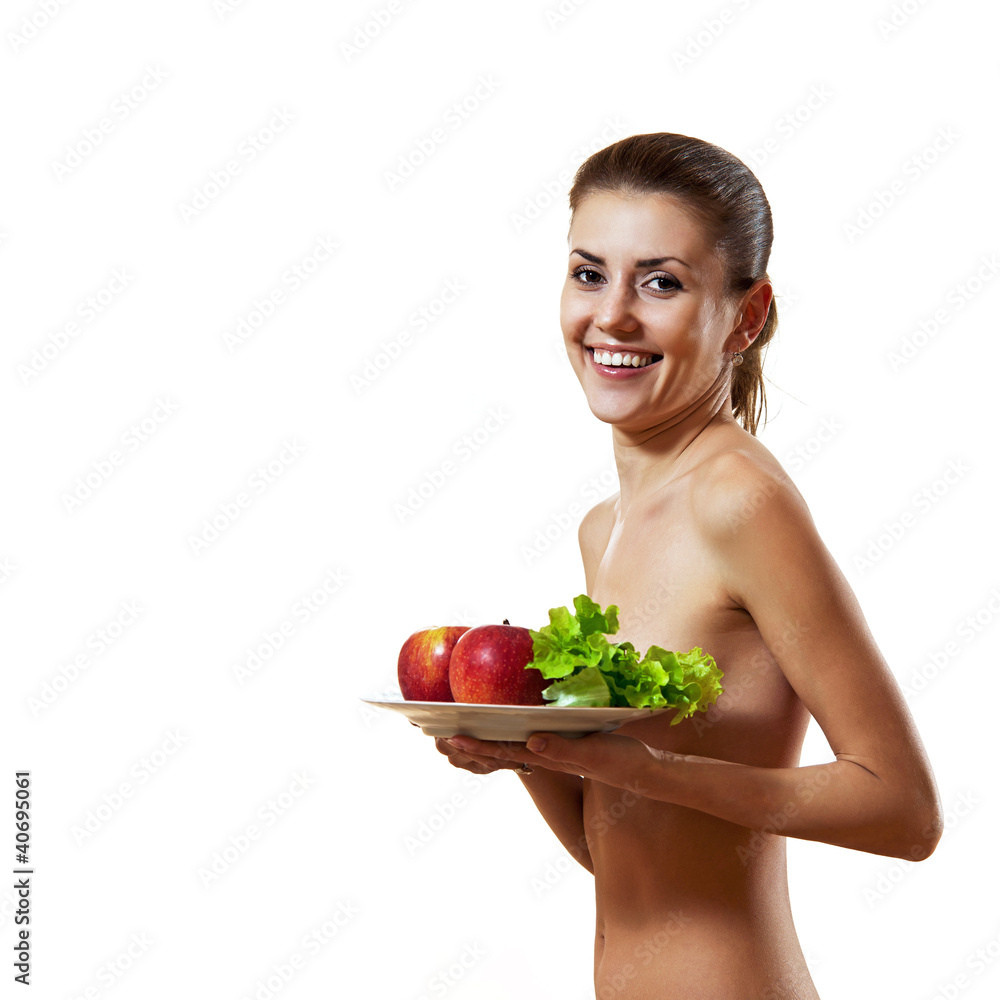 Beautiful young woman holding plate with apples and lettuce Beautiful young woman holding plate with apples and lettuce
