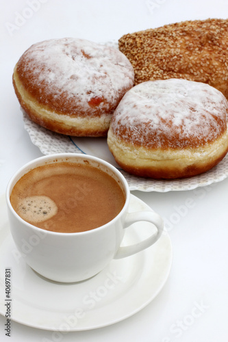 Coffee cup and pastry