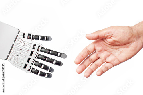 Robot and man handshake