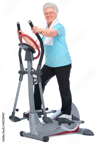Fotografie senior woman exercising on stepper
