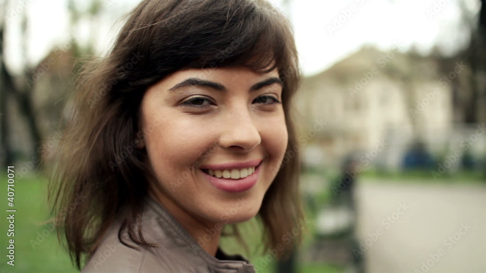 Attractive smiling happy woman in the city, steadicam shot Attractive smiling happy woman in the city, steadicam shot