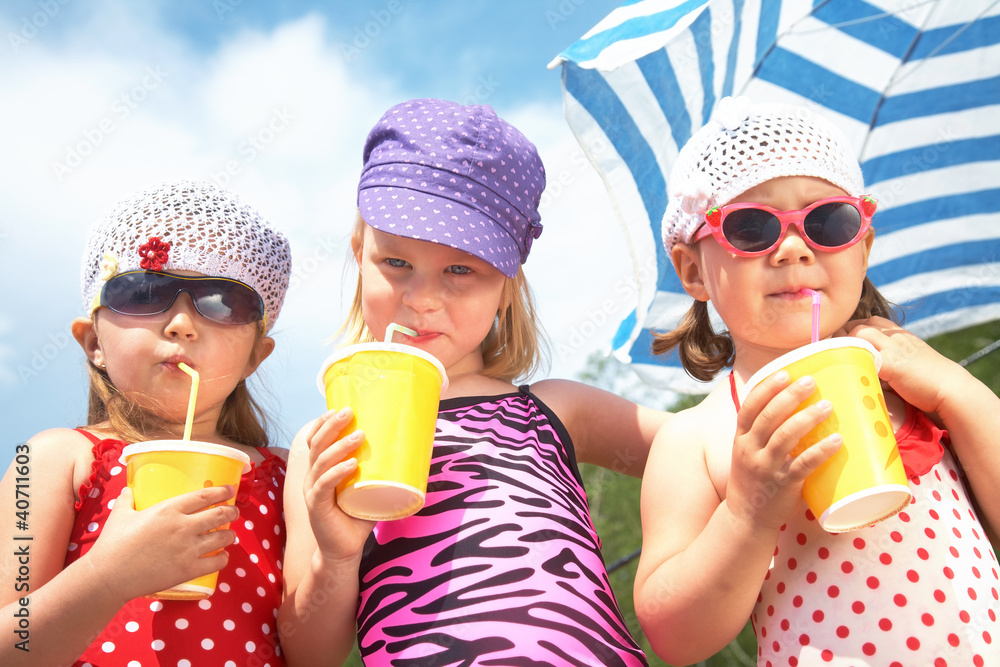Cute children with soft drinks