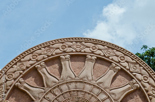 Detail of Dhammajak molding art at the temple photo