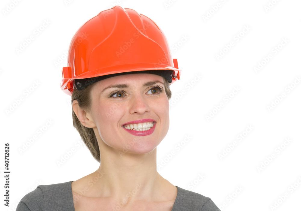 Portrait of dreaming architect woman in helmet isolated Portrait of dreaming architect woman in helmet isolated