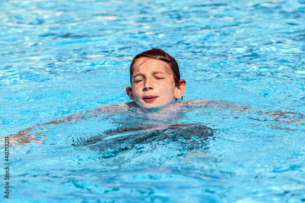 boy swimming in the pool