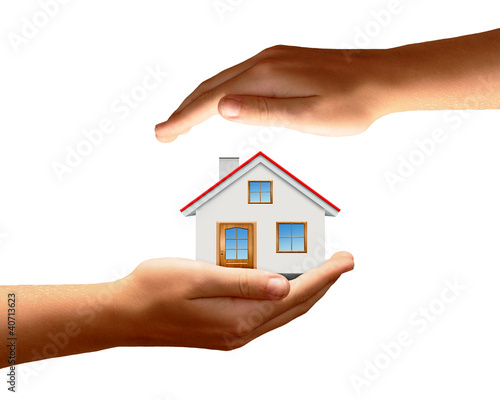 The house in hands isolated on white background