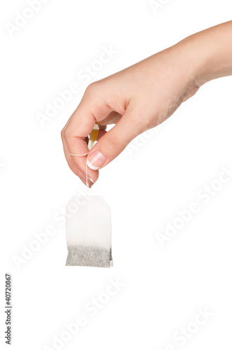 Tablou pe pânză Hand with teabag