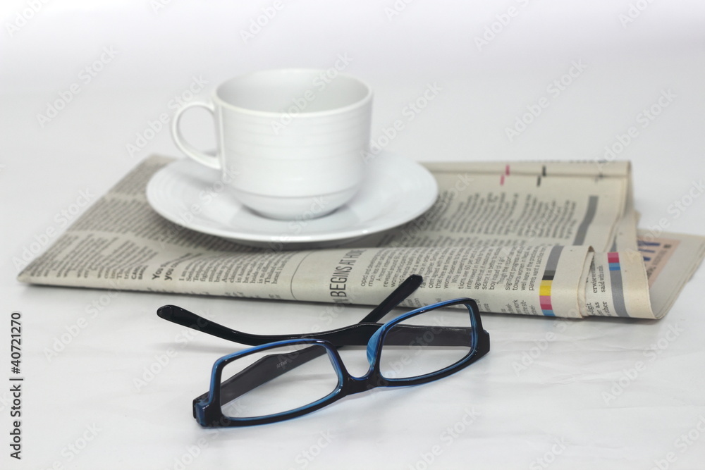 Glasses with the newspaper