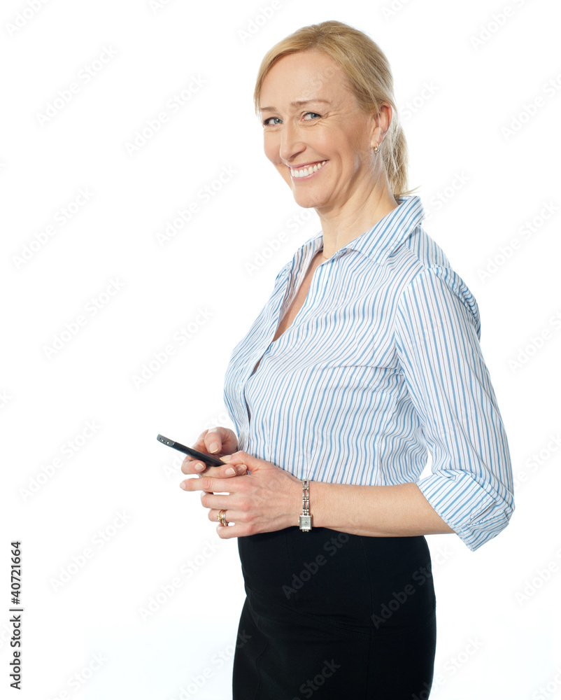 Beautiful corporate female using cellphone Beautiful corporate female using cellphone